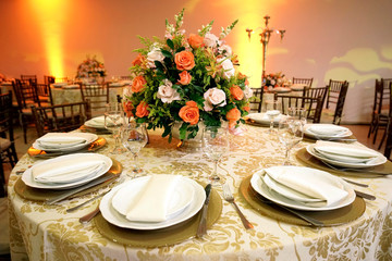 Table setting with glasses, plates, napkins and food