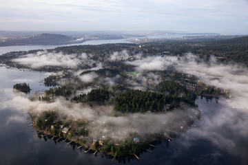 Deep Cove, Greater Vancouver, British Columbia, Canada. Beautiful view on the luxury homes during a cloudy early morning from an aerial perspective.
