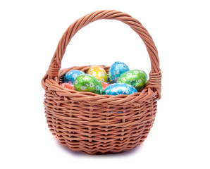 easter basket with decorative eggs on the white