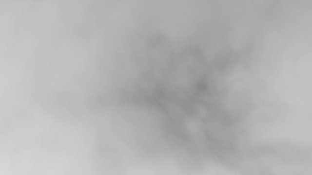 White smoke on a black background slow motion. Start moving the cloud from bottom to top slowly. The concept of transitions for video editing using the alpha channel.