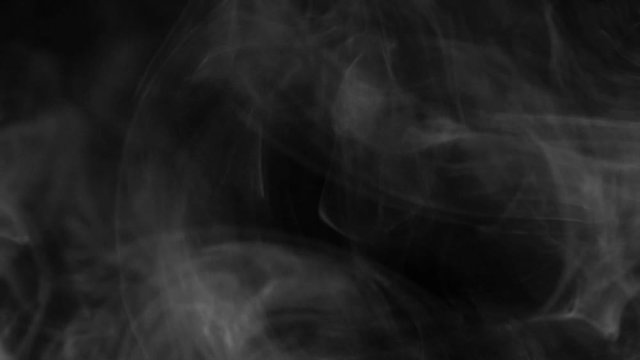 Real White Smoke On Black Background. The Concept Of Transitions For Video Editing Using The Alpha Channel. Effects For Double Exposure And Contrast Abstract.