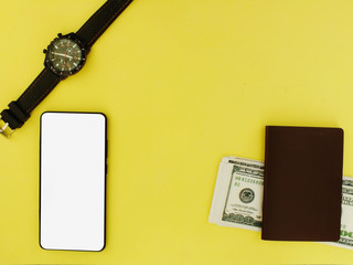 A white screen smartphone with a top $ 100 bank note and a yellow background calculator top view