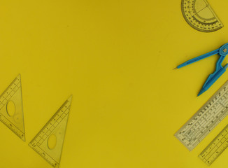 School supplies on a yellow background