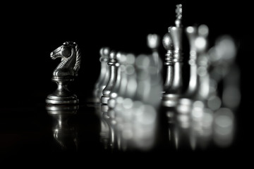 Pieces on chess board for playing game and strategy © Lane Erickson