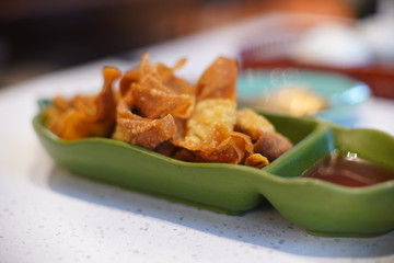 Fried dumpling serve on green dish