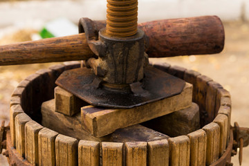 The squeezer is used to press the wine. Technology of wine production in Moldova. The folk tradition of making wine. The ancient tradition of grape processing. Harvest home.
