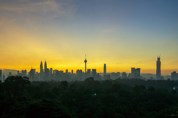 Fototapeta na wymiar Majestic view of sunrise over downtown Kuala Lumpur, Malaysia.