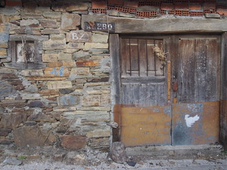 Closeup of an old stylish wooden door of typical rural house in north of Spain, El Camino de Santiago, Journey from Foncebadon to Ponferrada, French way, Spain