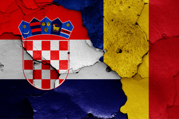 flags of Croatia and Romania painted on cracked wall