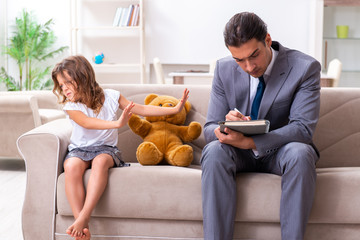 Child psychologist attending small girl