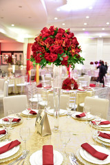 Table setting with glasses, plates, napkins and food