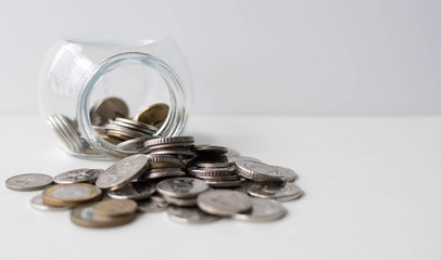 Saving money for future investment. Coins in a jar. Coins in a bottle