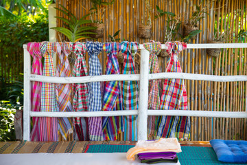 Loincloths are used for bathing and towels of rural people in asian countries, especially Thailand. There are many patterns, which the villagers will hang and tie on the house.