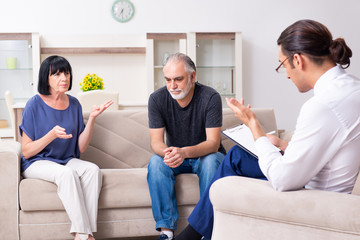 Old couple visiting psychiatrist doctor