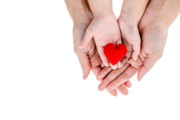 Obraz premium Love concept: Mother and kid's hands hold red heart on white background and clipping path