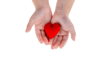 Obraz premium Love concept: kid's hand hold a red heart on white background and clipping path