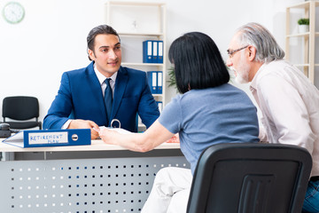 Financial advisor giving retirement advice to old couple