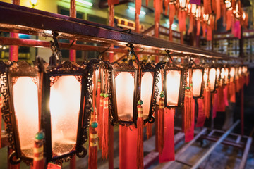 close up chinese lantern glowing in temple