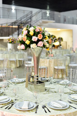 Table setting with glasses, plates, napkins and food