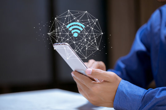 Business using smartphone,with wifi icon,business communication social network concept.