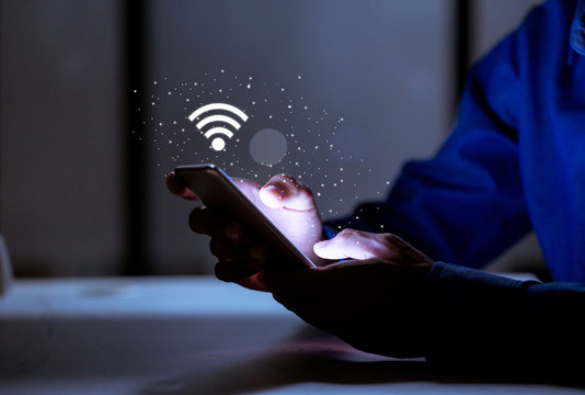 Business using smartphone,with wifi icon,business communication social network concept.