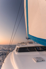 Sailing at dawn with light winds