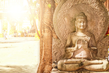 Fototapeta na wymiar The statues of the Lord Buddha with the fair and the space for inserting text Symbol of peace