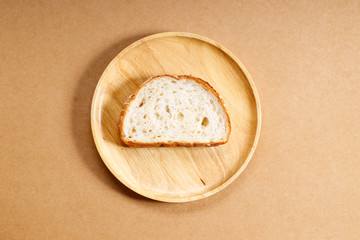 sliced whole grain bread on wooden dish
