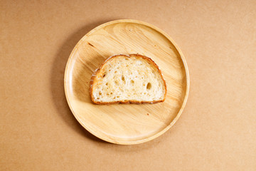 toasted whole grain bread on wooden dish