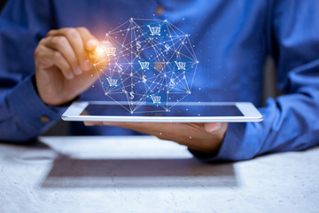 Business using tablet,with shopping cart icon,sale volume increase make business growth and shopping online concept.
