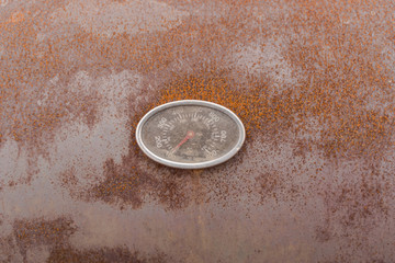 Close-up. Pressure sensor on rusty grunge metal background