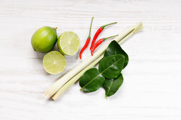 Fresh green limes and half with spices