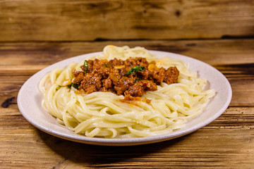 Pasta with bolognese sauce in a ceramic plate