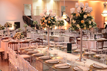 Table setting with glasses, plates, napkins and food