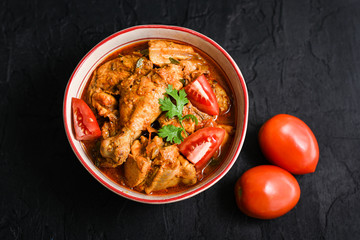 Tomato chicken curry hot and spicy non vegetarian dish Kerala, India.