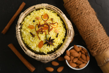 Biryani, Pulao spicy mixed rice dish with, almonds festival food Hyderabad, India.