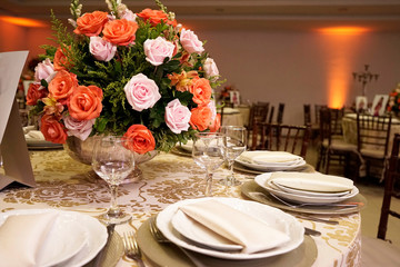 Table setting with glasses, plates, napkins and food