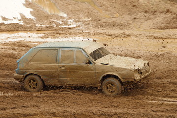 Old German front wheel drive dirty racing car on off road race, auto cross competition