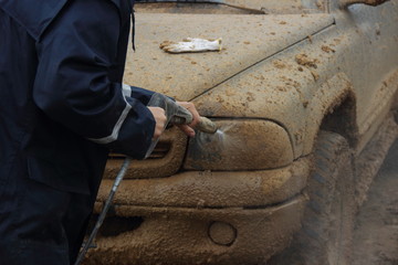 Dirty head light car American 4x4 pickup truck close up high pressure cleaning © Ilya
