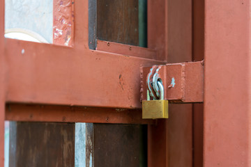 old padlock on a wooden door