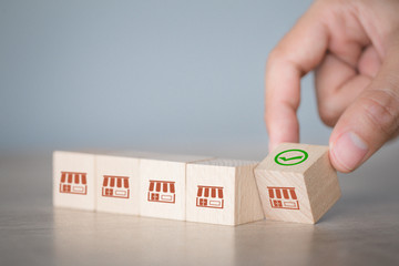 Franchise business concept,hand choose wood blog with franchise marketing.