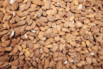 Background make from salt pistachios in a shell. A lot of pistachio nuts