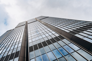 Fototapeta na wymiar Blue skyscraper facade. office buildings. modern glass silhouettes