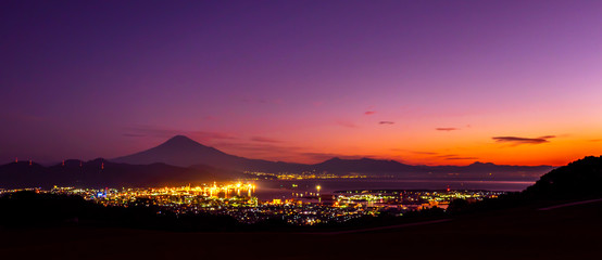 Panorama of sunrise over Mt. Fuji / Fuji Mountain and Shimizu Industrial Port at Nihondaira,...