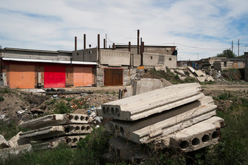 Fototapeta na wymiar Abstract architectural background. Garages. Garage cooperative. Kazakhstan, Ust-kamenogorsk, may 2019. Unfinished buildings