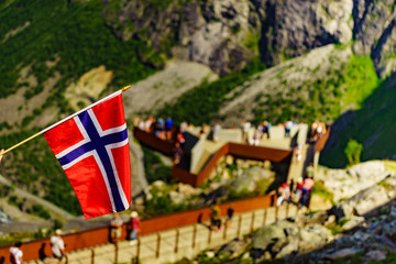 Fototapeta na wymiar Norwegian flag and Trollstigen viewing point