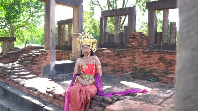 Portrait of asian woman wear ancient thai dress style and makeup ghost face at the old castles,Thailand people