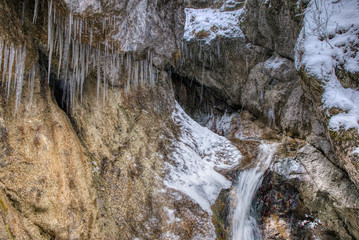 Large stalactites with ice in the mountains on a rock , slovakia mala fatra