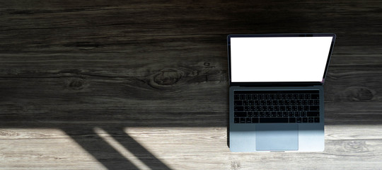 businessman using laptop at home Laptop with blank screen on table  notebook space