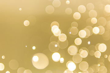 abstract gold background with soft blur bokeh light effect, background bokeh